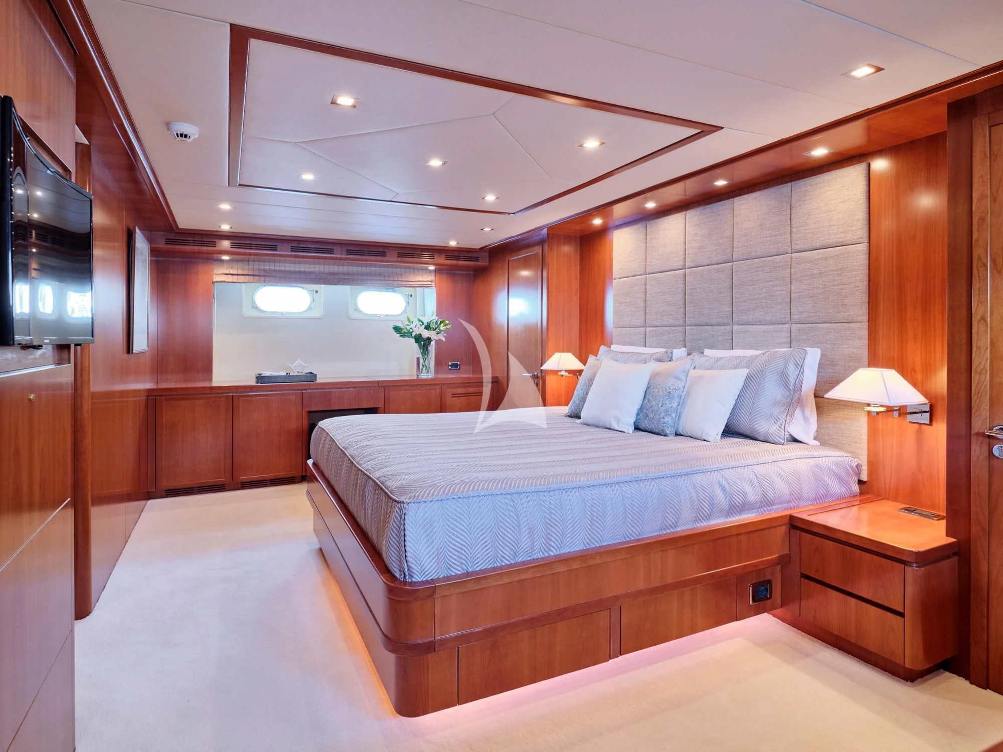 a large bed in a room aboard HELIOS Yacht for Charter