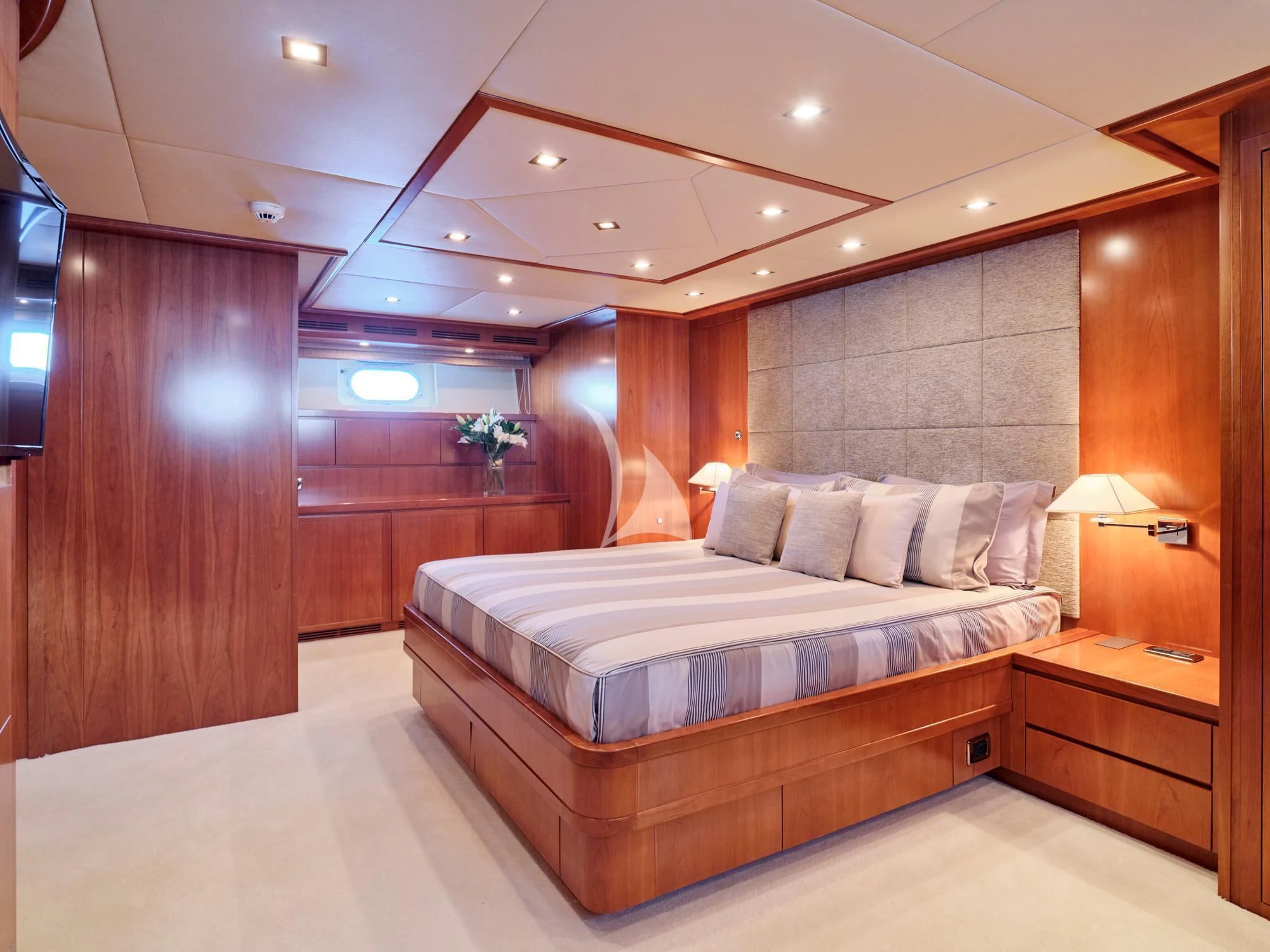 a hotel room with a bed aboard HELIOS Yacht for Charter