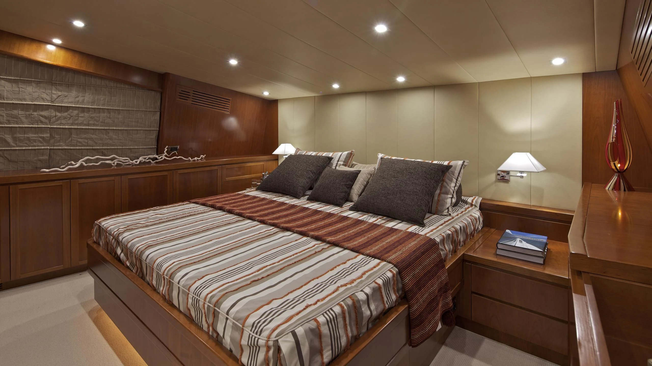 a bed in a room aboard HELIOS Yacht for Charter