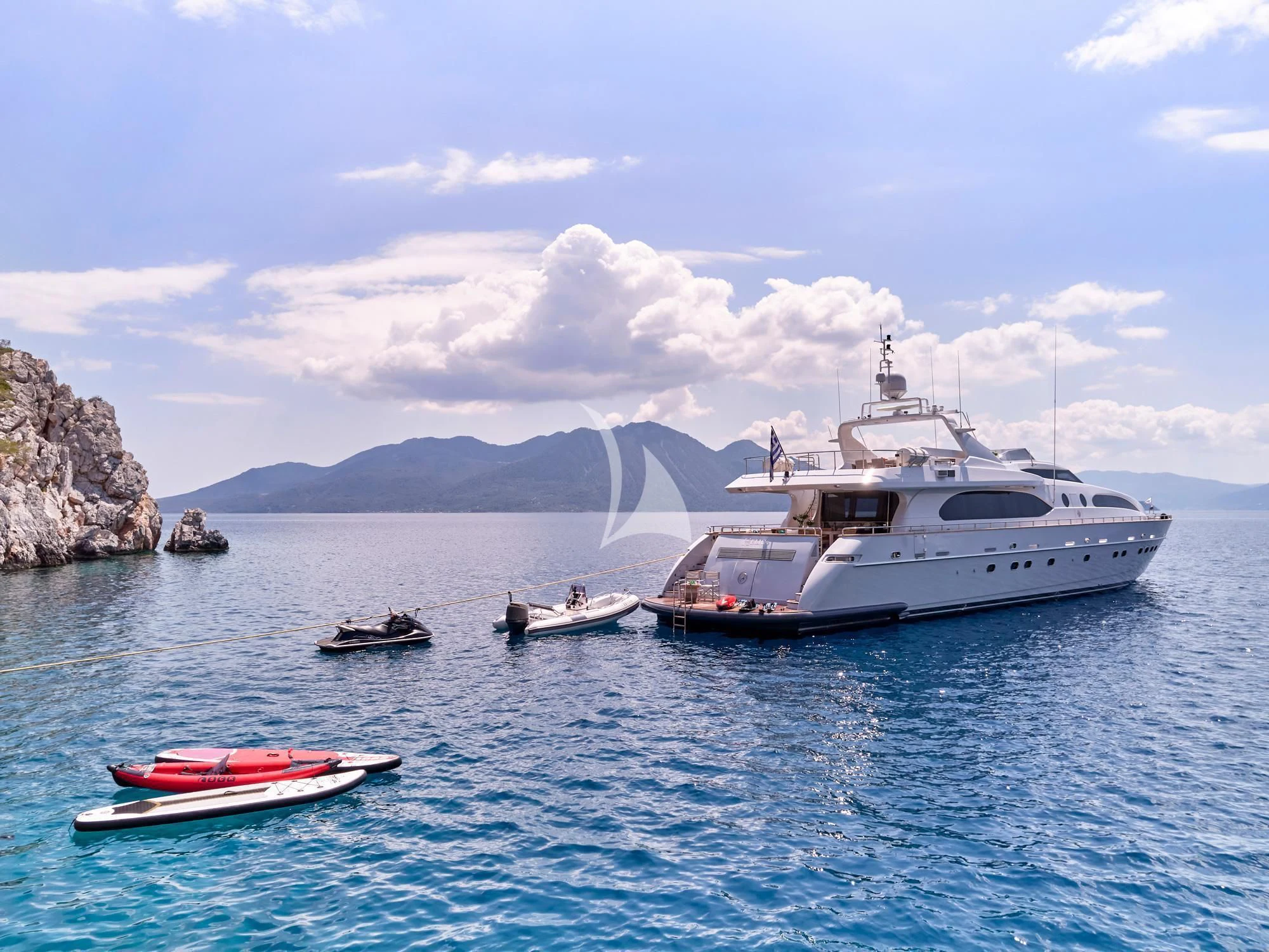 a group of boats in the water aboard HELIOS Yacht for Charter