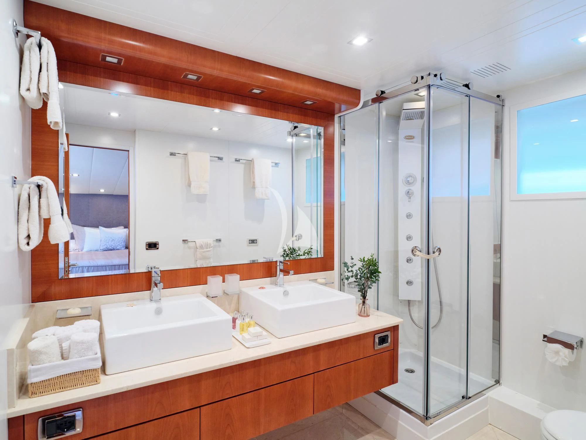 a bathroom with a glass shower aboard HELIOS Yacht for Charter