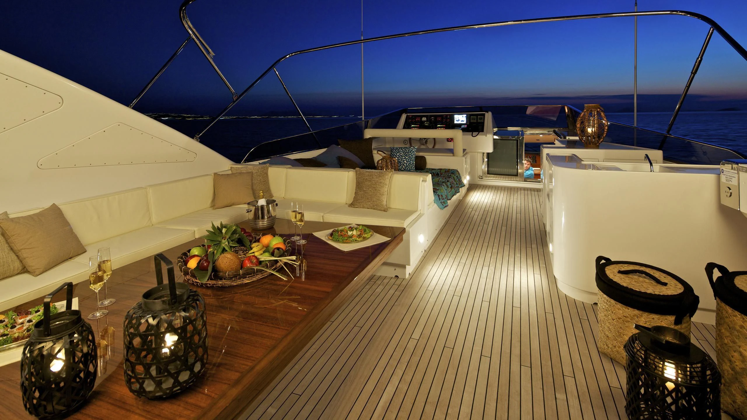 a room with a large white tent and a table with food on it aboard HELIOS Yacht for Charter