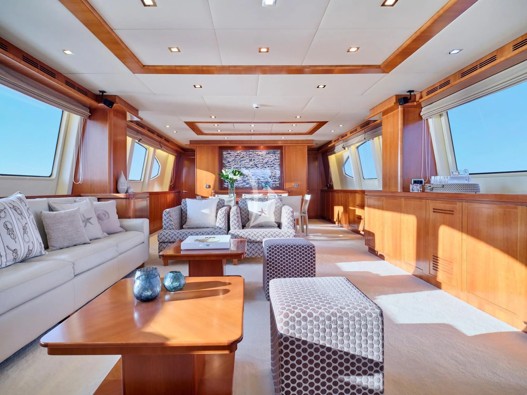 a room with a couch and a table aboard HELIOS Yacht for Charter