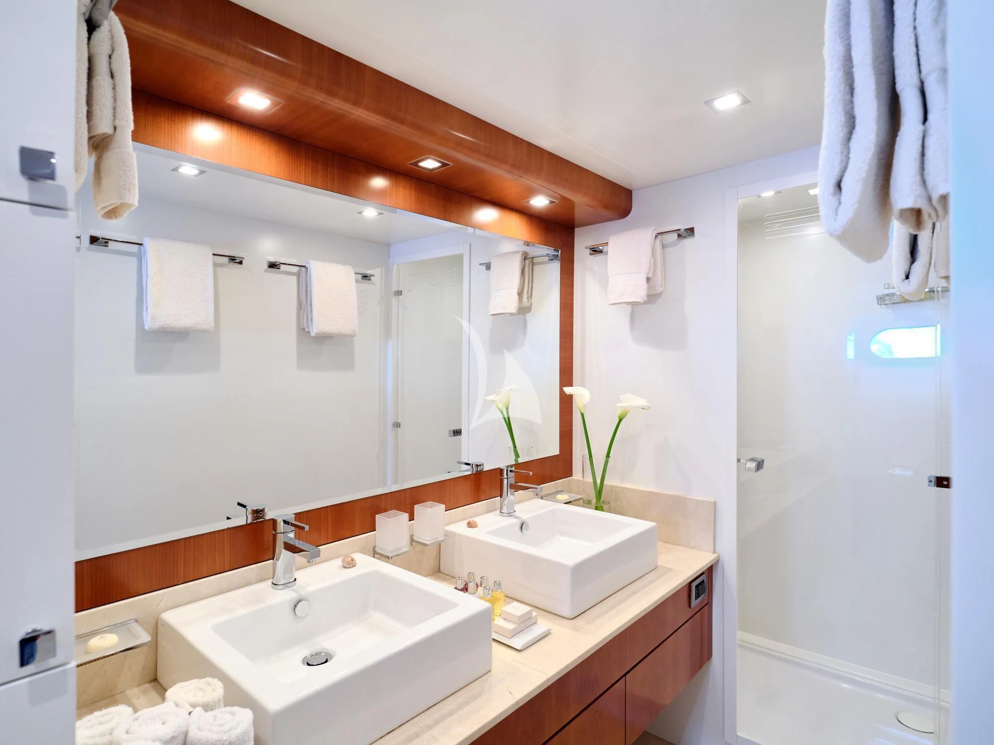 a bathroom with a sink and a mirror aboard HELIOS Yacht for Charter