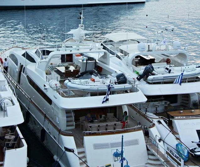 a boat docked at a port aboard HELIOS Yacht for Charter