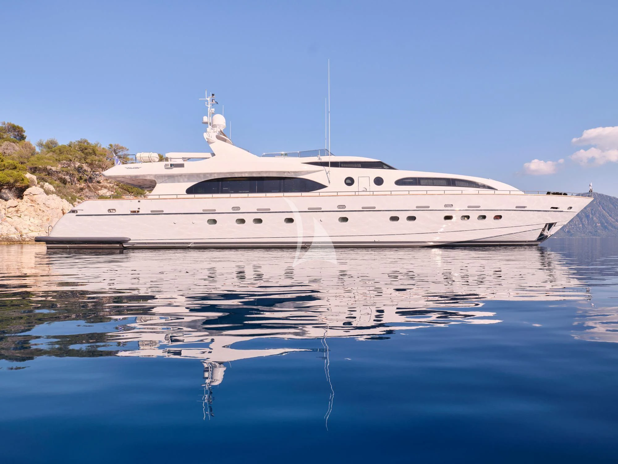 a white yacht in the water aboard HELIOS Yacht for Charter