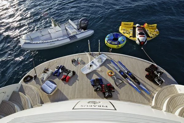 a boat with a group of boats on it aboard HELIOS Yacht for Charter