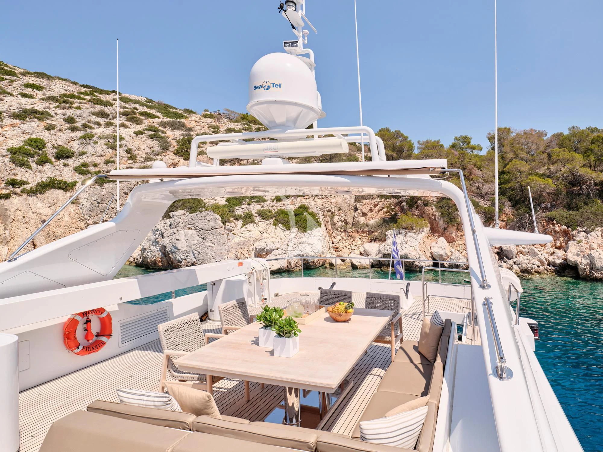 a large white boat on a body of water aboard HELIOS Yacht for Charter