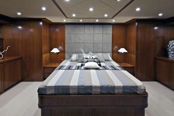 a large bed in a room aboard HELIOS Yacht for Charter
