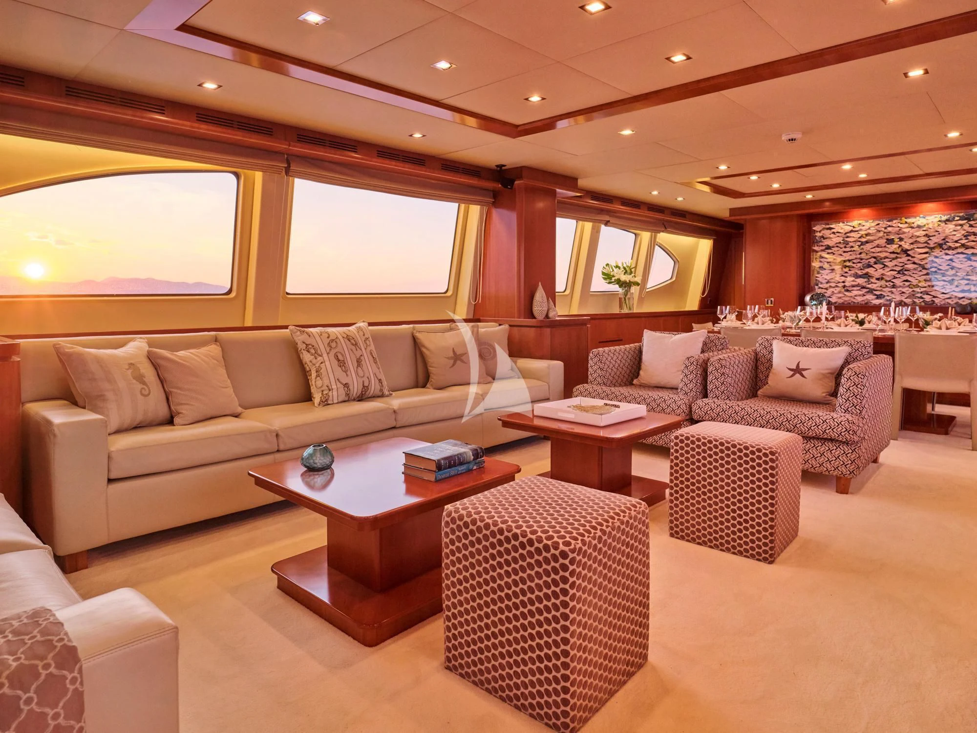 a living room with a couch and a coffee table aboard HELIOS Yacht for Charter