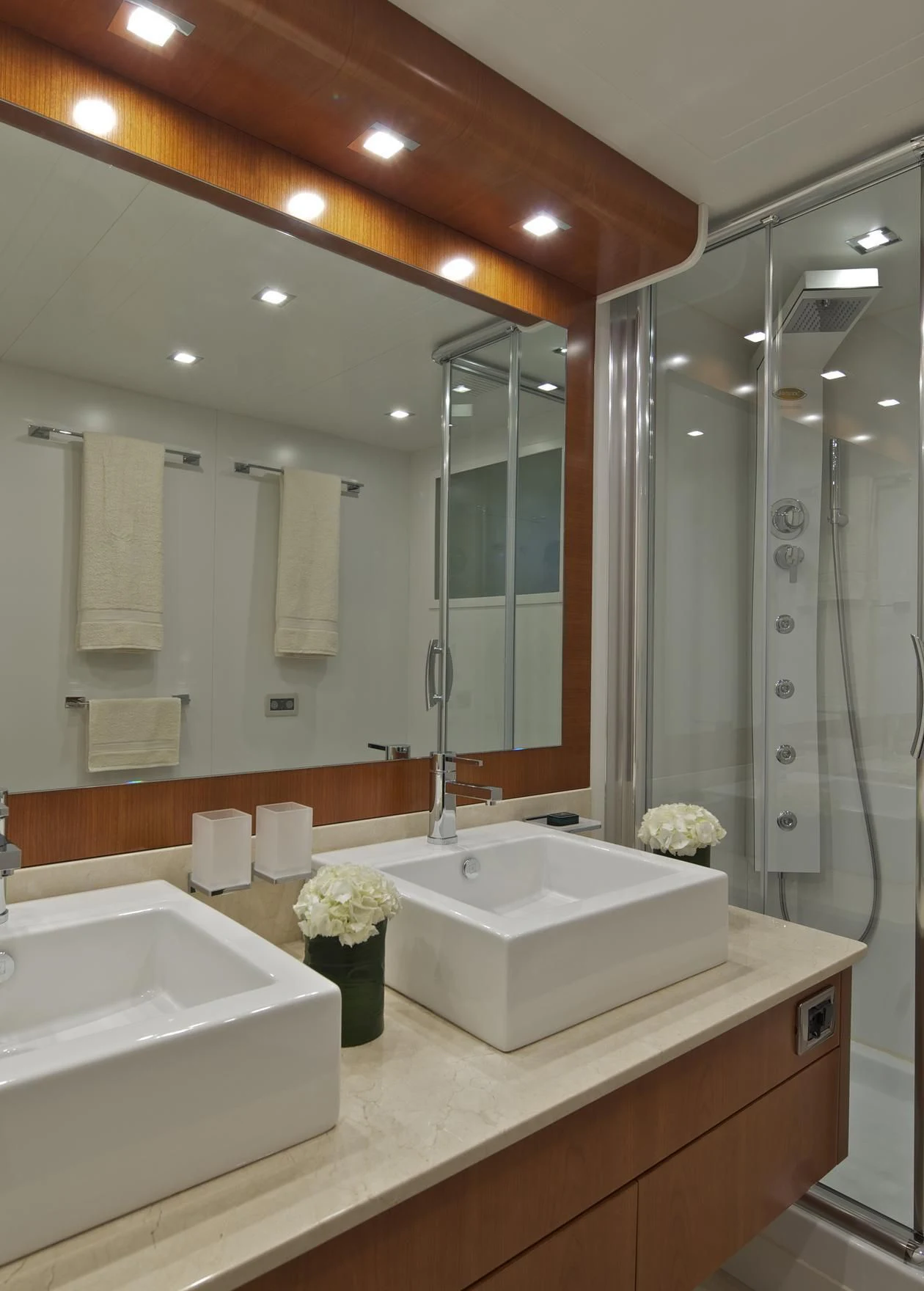 a bathroom with a large mirror aboard HELIOS Yacht for Charter