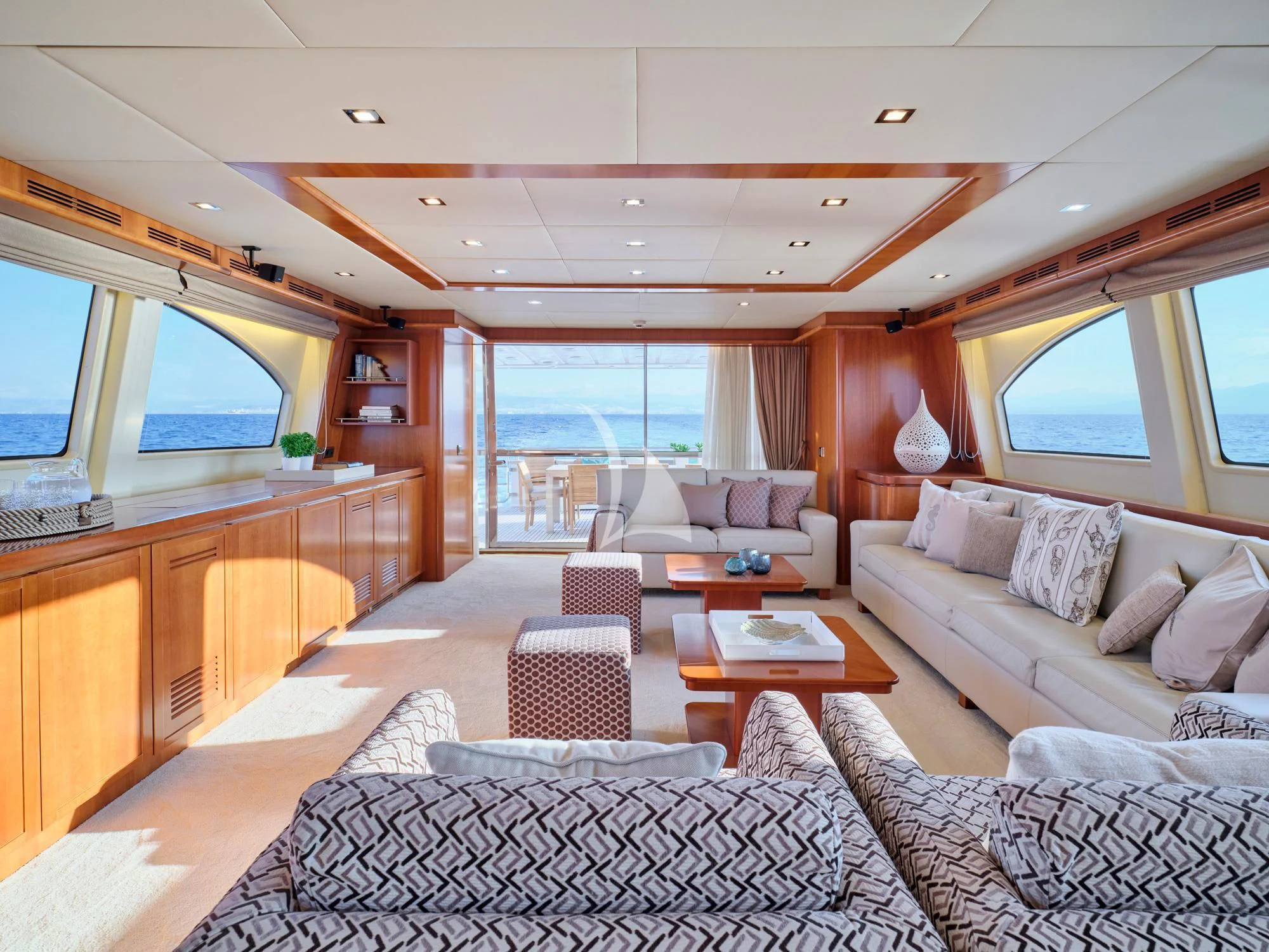 a living room with a large window aboard HELIOS Yacht for Charter
