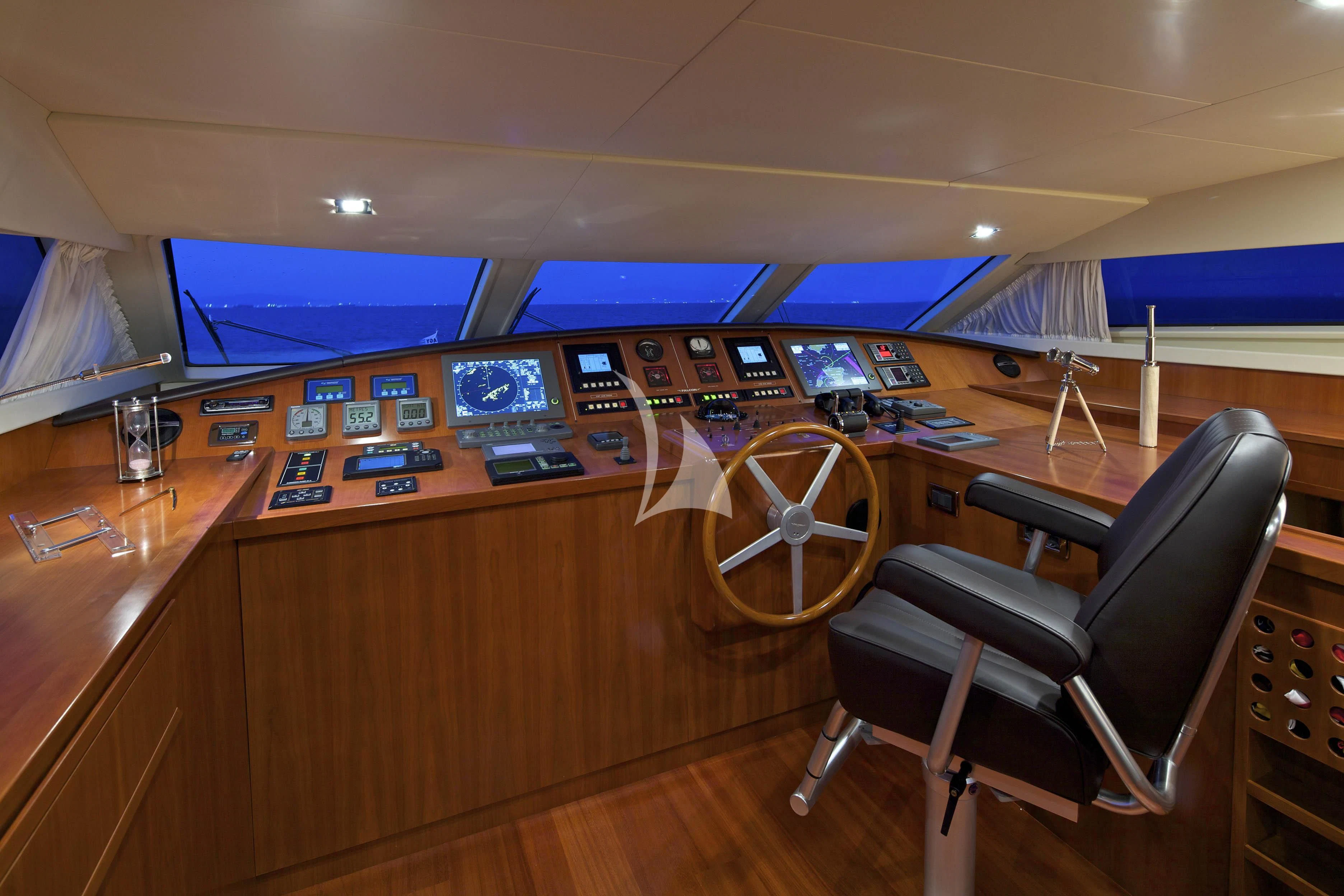 a control room with a chair aboard HELIOS Yacht for Charter