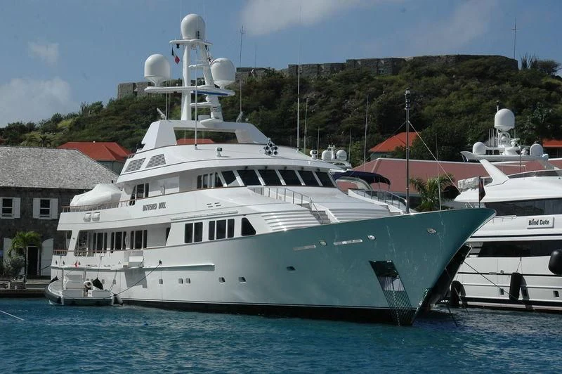 a couple of large white boats in a harbor aboard MARIA Yacht for Sale