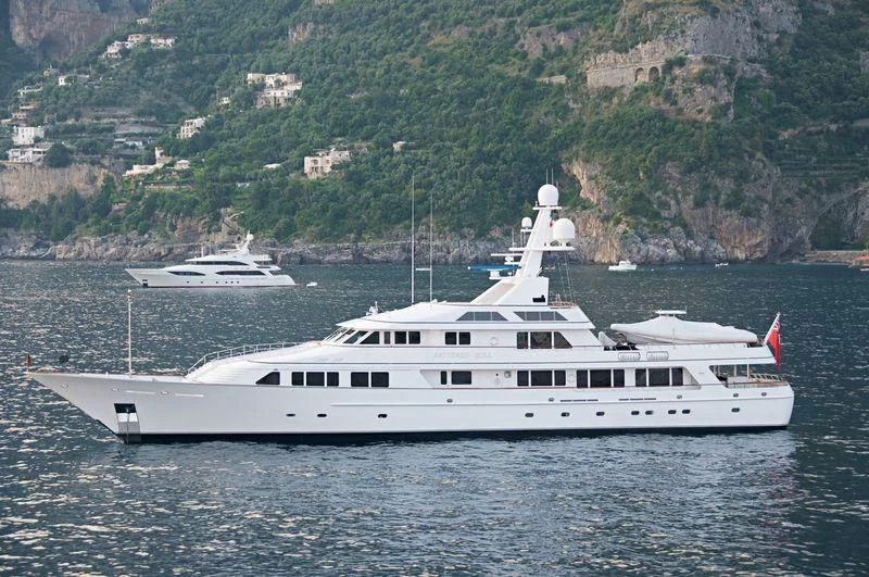 a couple of boats on the water aboard MARIA Yacht for Sale