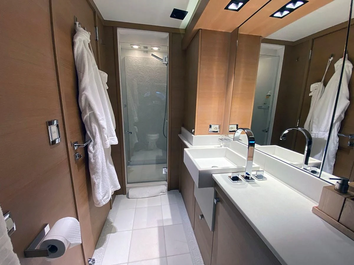 a bathroom with a sink and a shower aboard ESCAPE Yacht for Sale