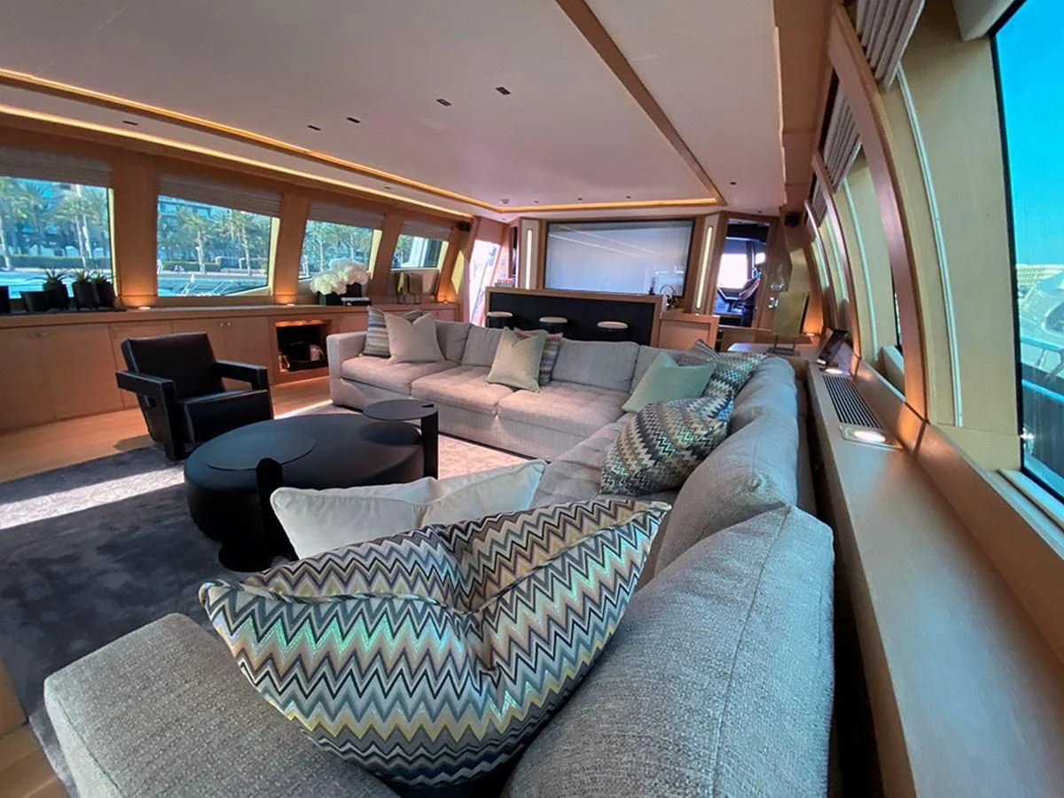 a living room with a large window aboard ESCAPE Yacht for Sale