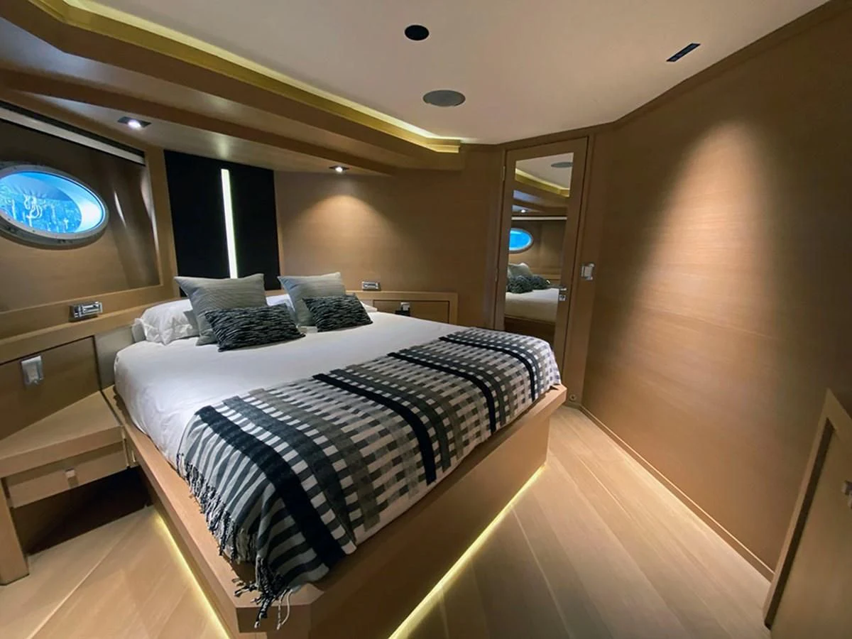 a bed in a room aboard ESCAPE Yacht for Sale