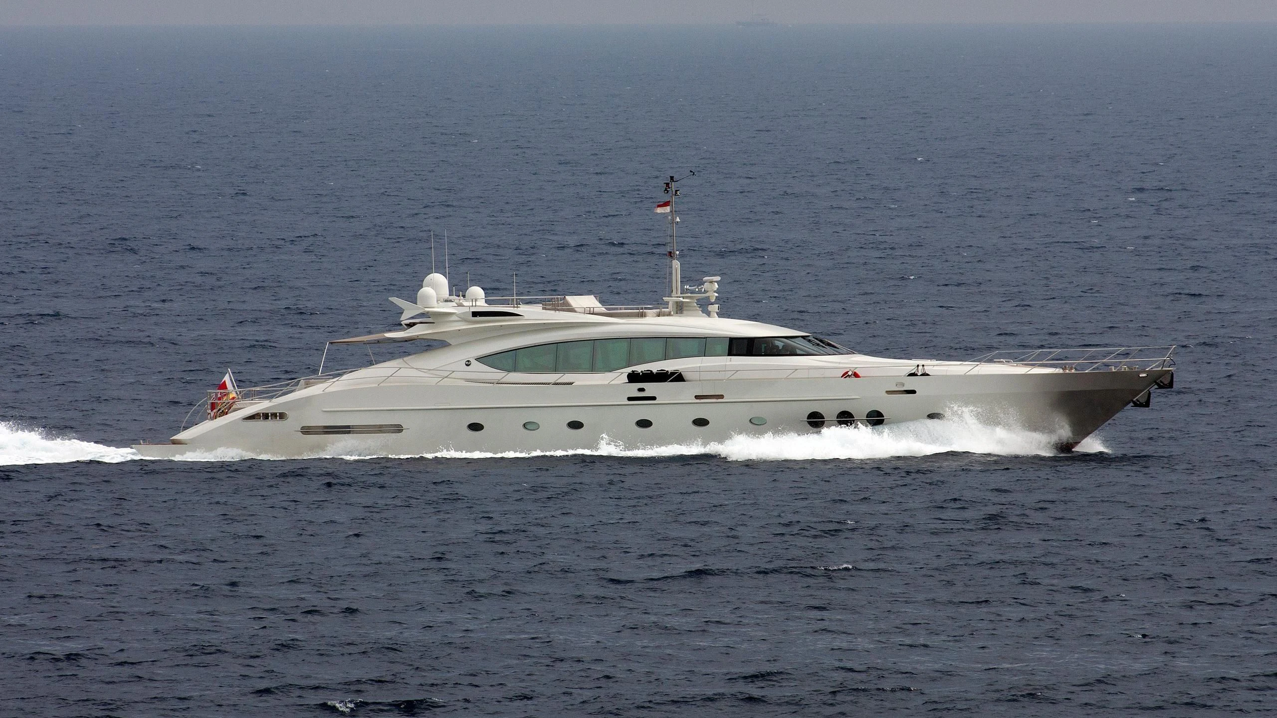 a white yacht in the ocean aboard ESCAPE Yacht for Sale