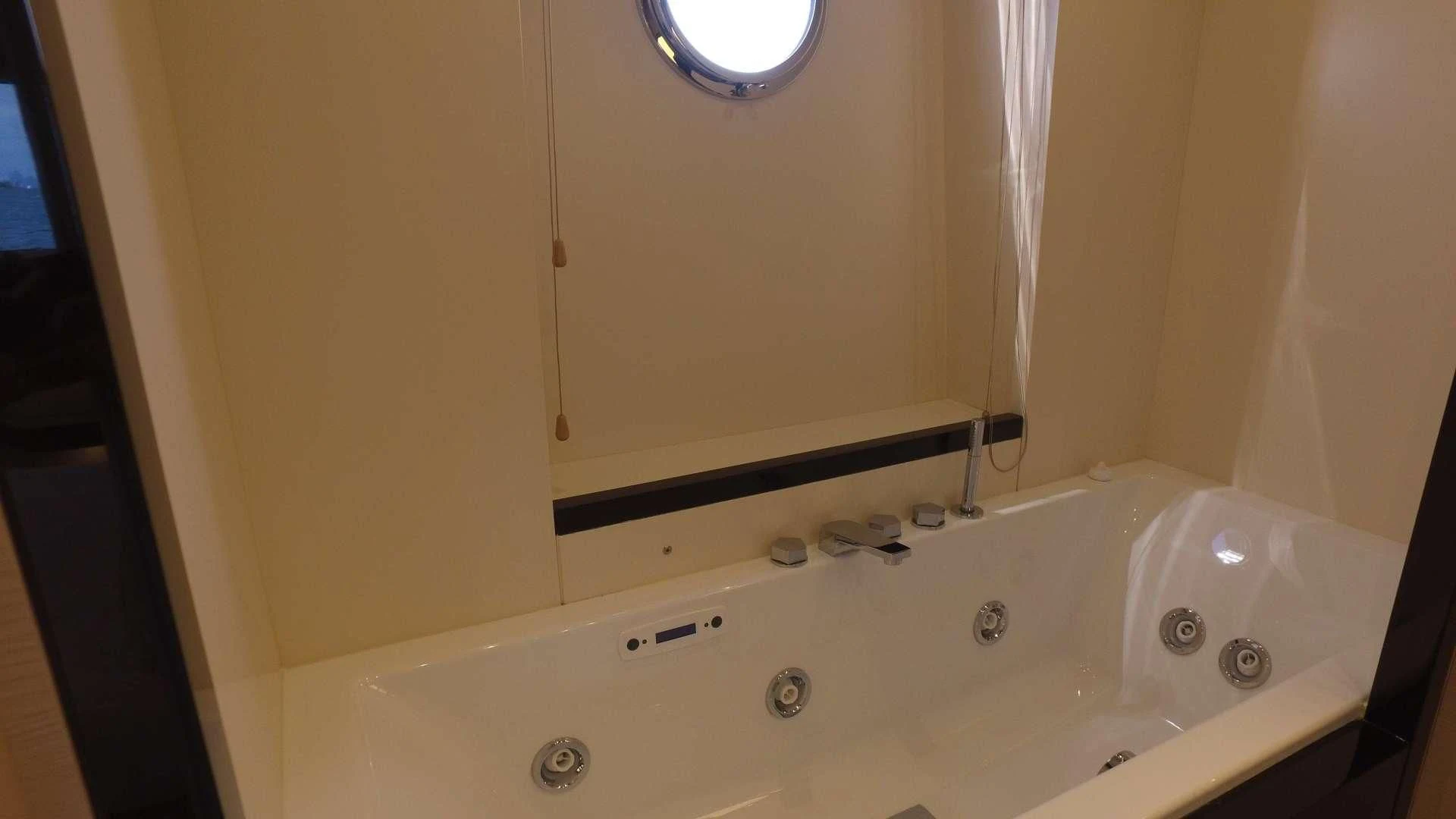 a bathtub with a sink aboard SOLACE NT Yacht for Sale