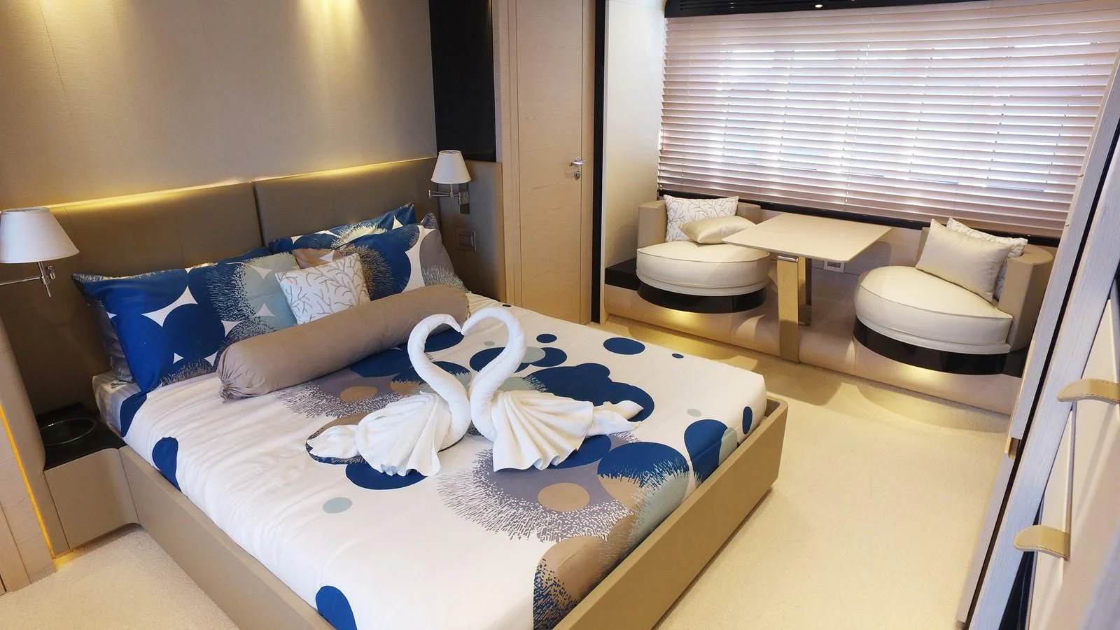 a bed with a blue and white bed spread aboard SOLACE NT Yacht for Sale