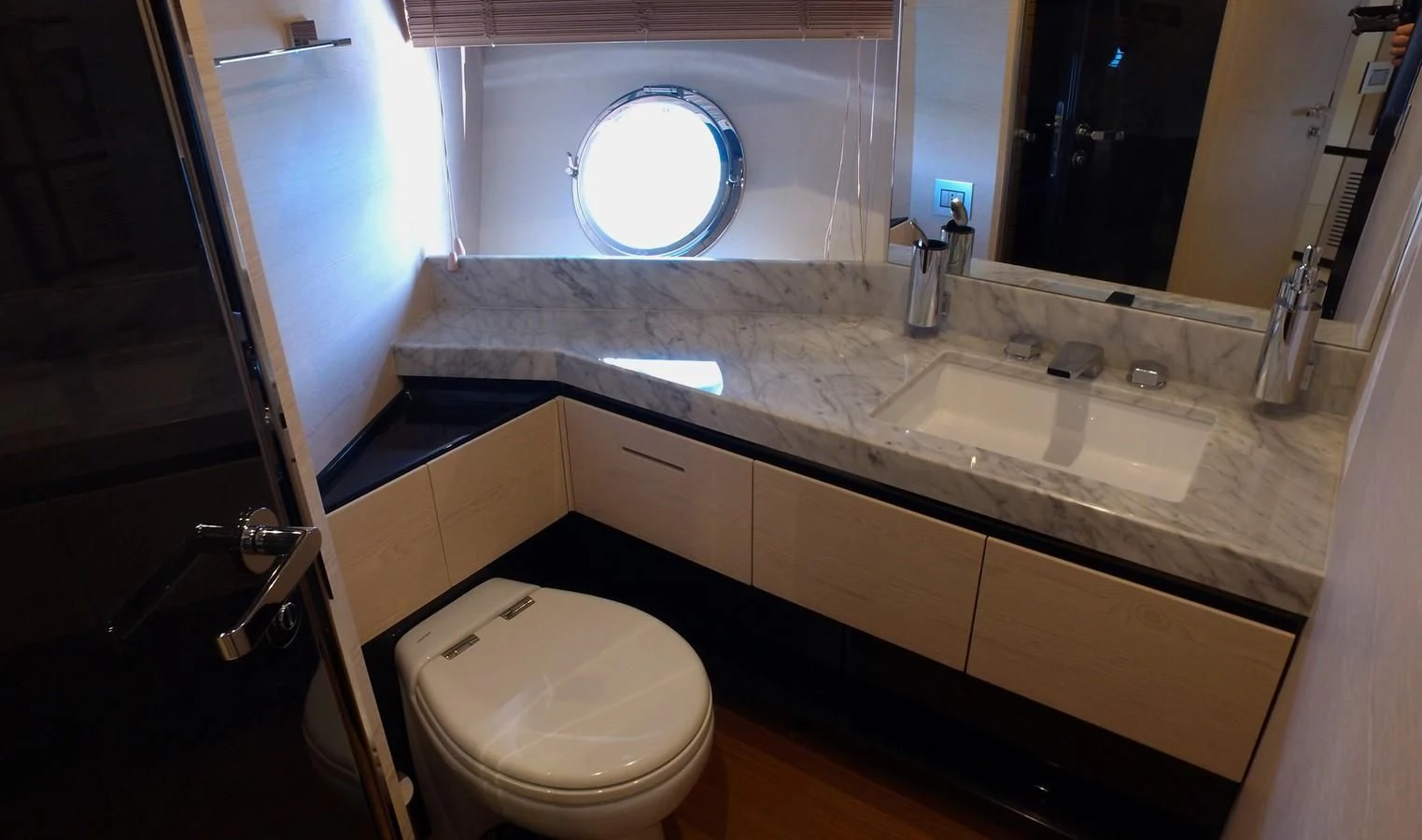 a bathroom with a sink and a toilet aboard SOLACE NT Yacht for Sale