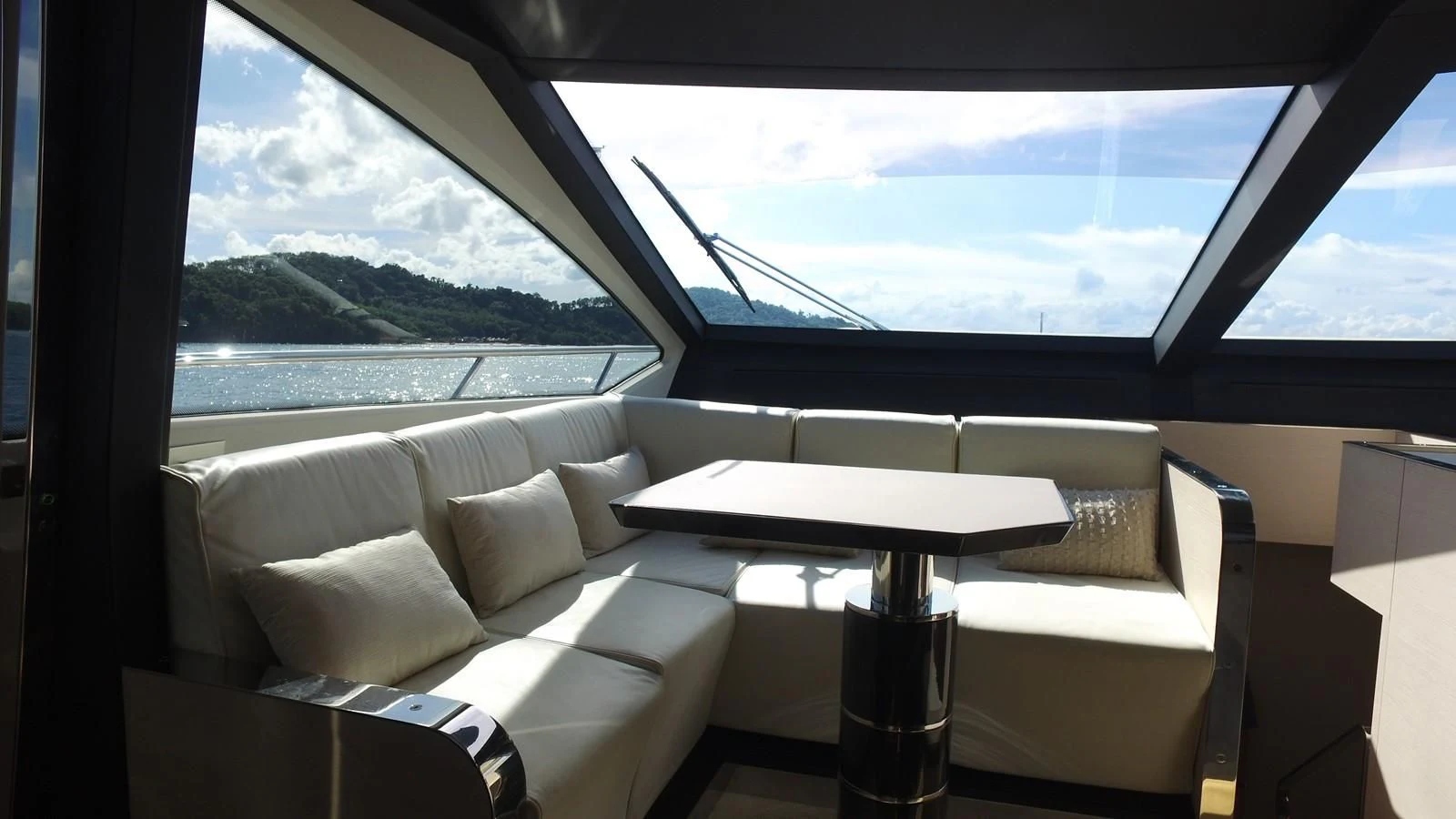a room with a table and chairs aboard SOLACE NT Yacht for Sale