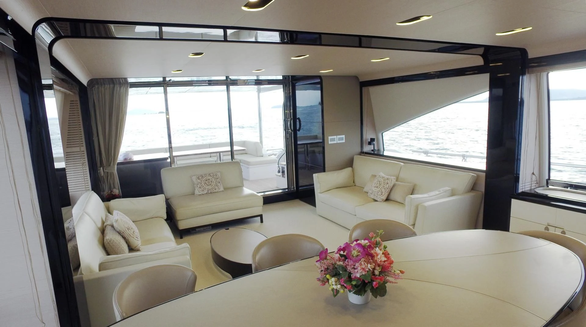 a living room with a large window aboard SOLACE NT Yacht for Sale