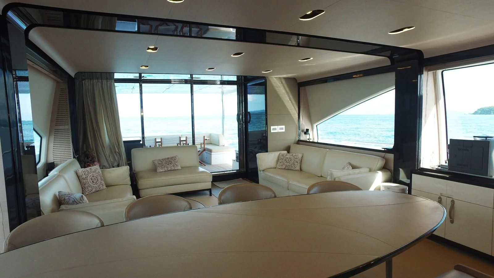 a living room with a large window aboard SOLACE NT Yacht for Sale