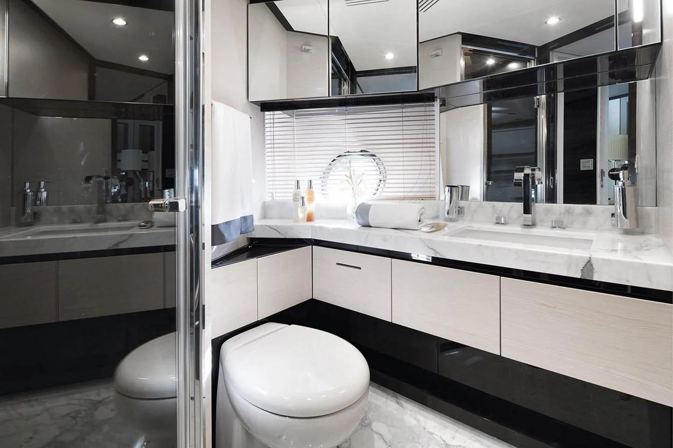 a bathroom with a sink and a toilet aboard SOLACE NT Yacht for Sale