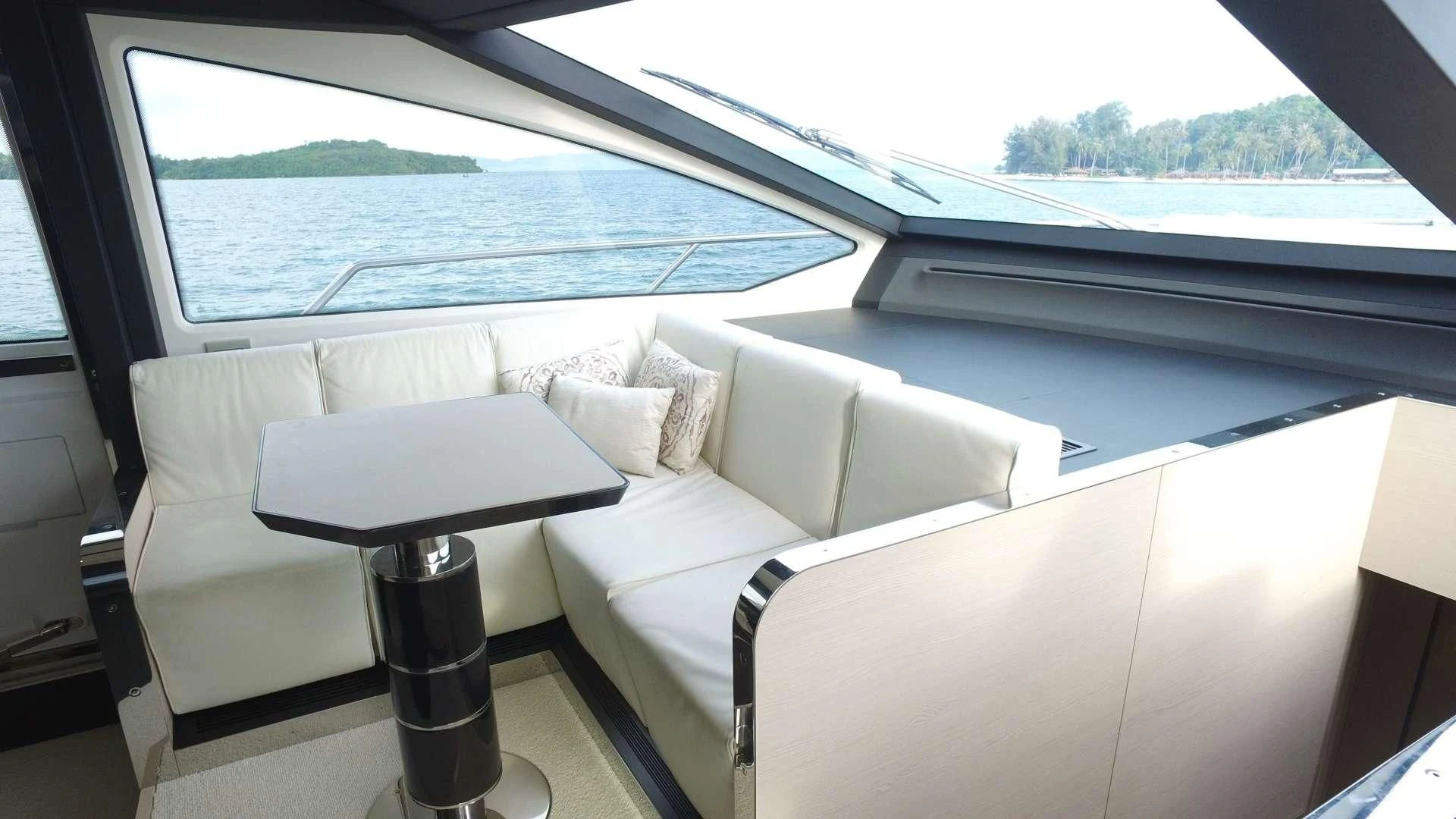 a white couch in a room aboard SOLACE NT Yacht for Sale