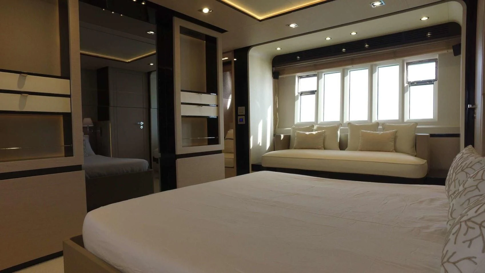 a hotel room with a bed and a couch aboard SOLACE NT Yacht for Sale