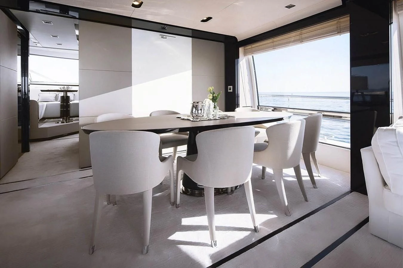 a large white table with chairs around it aboard SOLACE NT Yacht for Sale