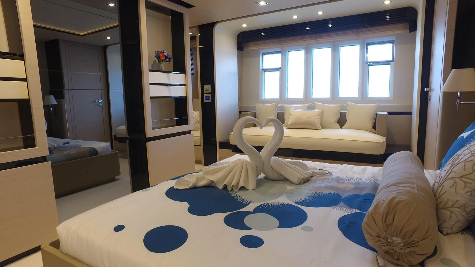 a room with a bed and a couch aboard SOLACE NT Yacht for Sale