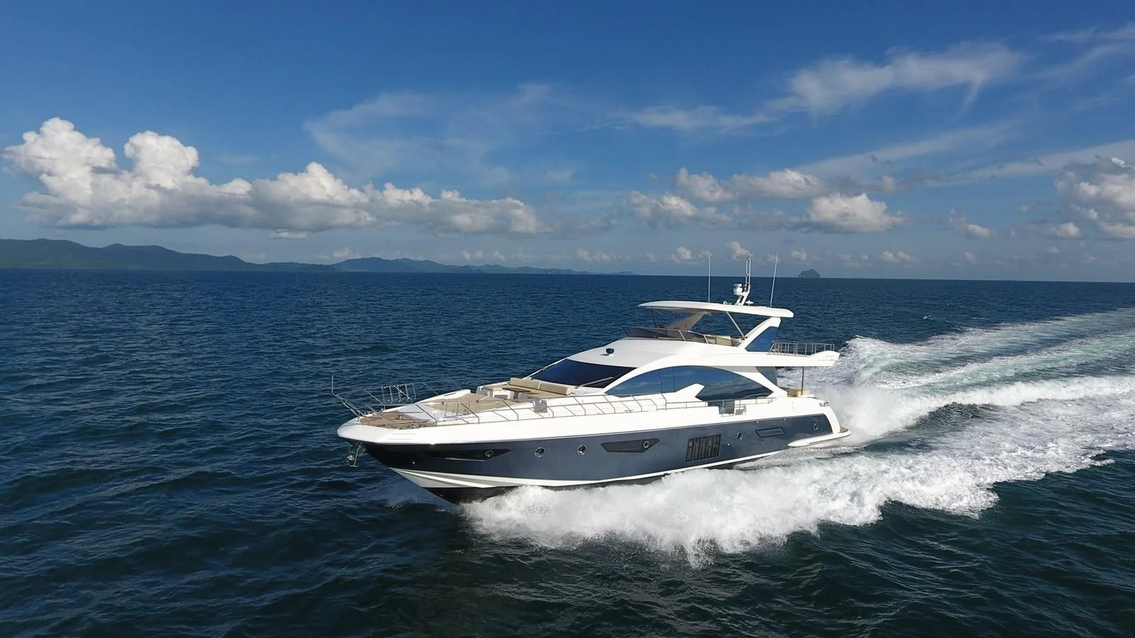 a white yacht on the water aboard SOLACE NT Yacht for Sale