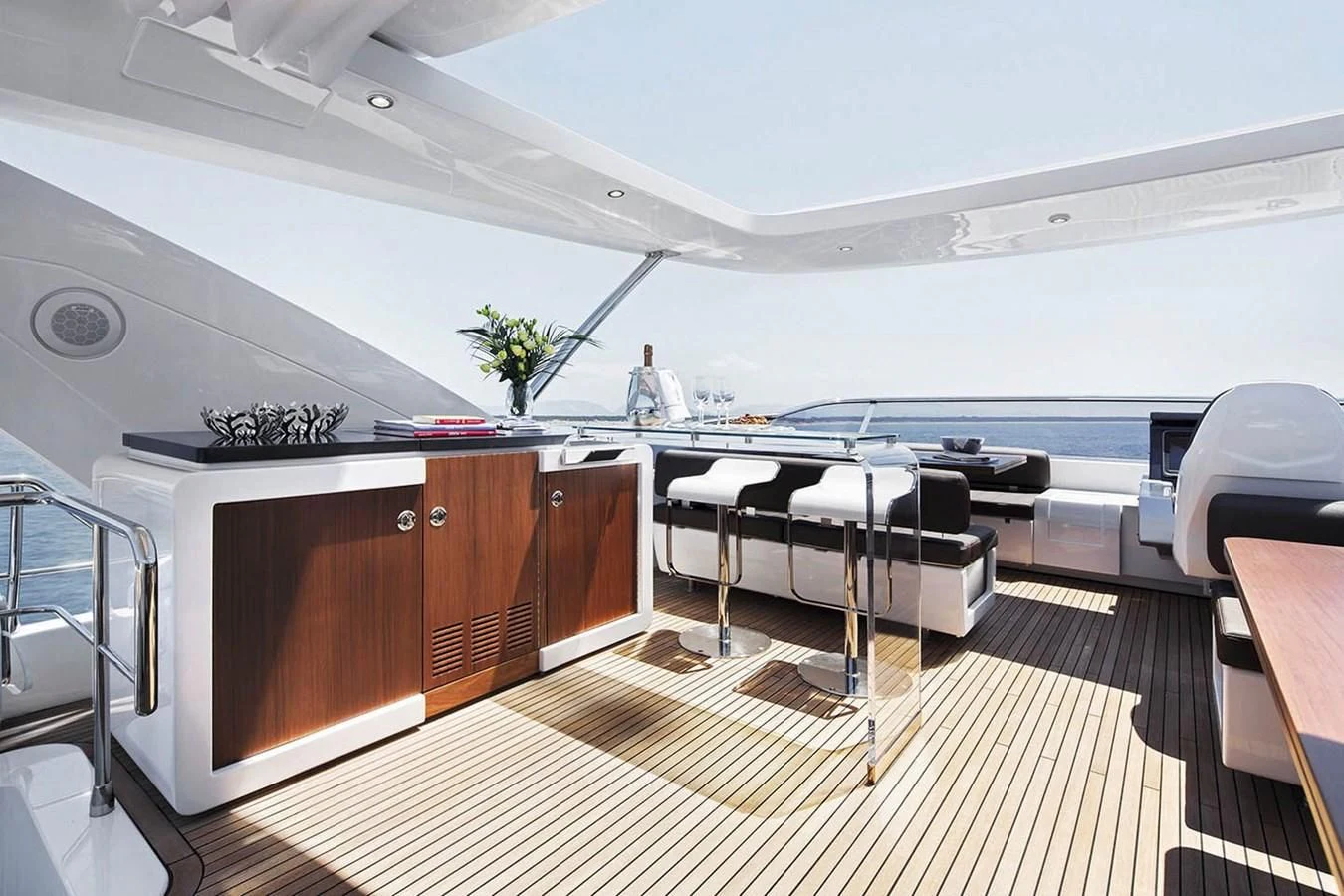 a large room with a table and chairs aboard SOLACE NT Yacht for Sale