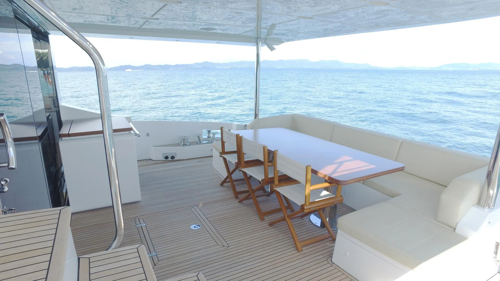 a room with a table and chairs aboard SOLACE NT Yacht for Sale