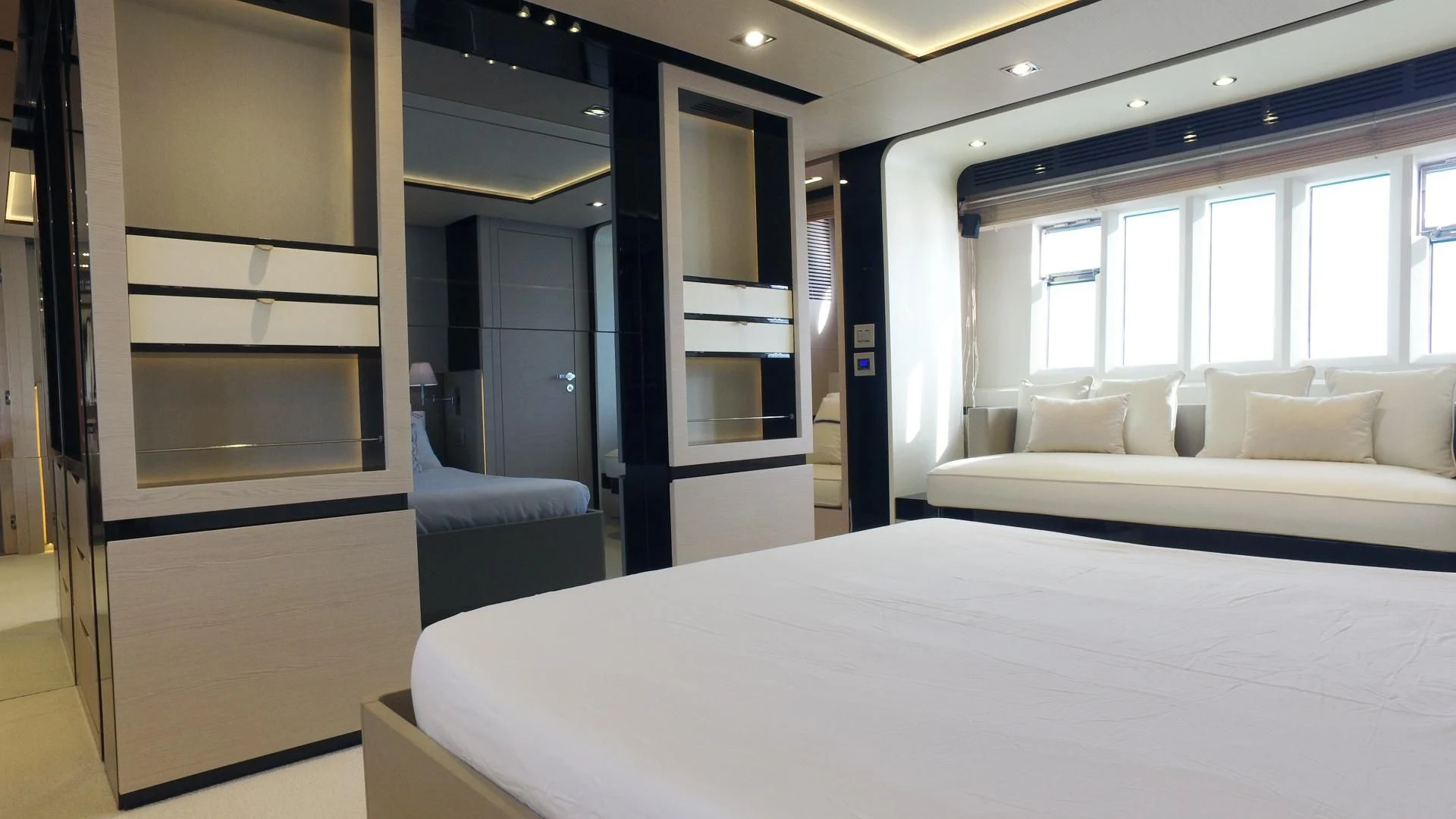 a hotel room with a bed and a chair aboard SOLACE NT Yacht for Sale