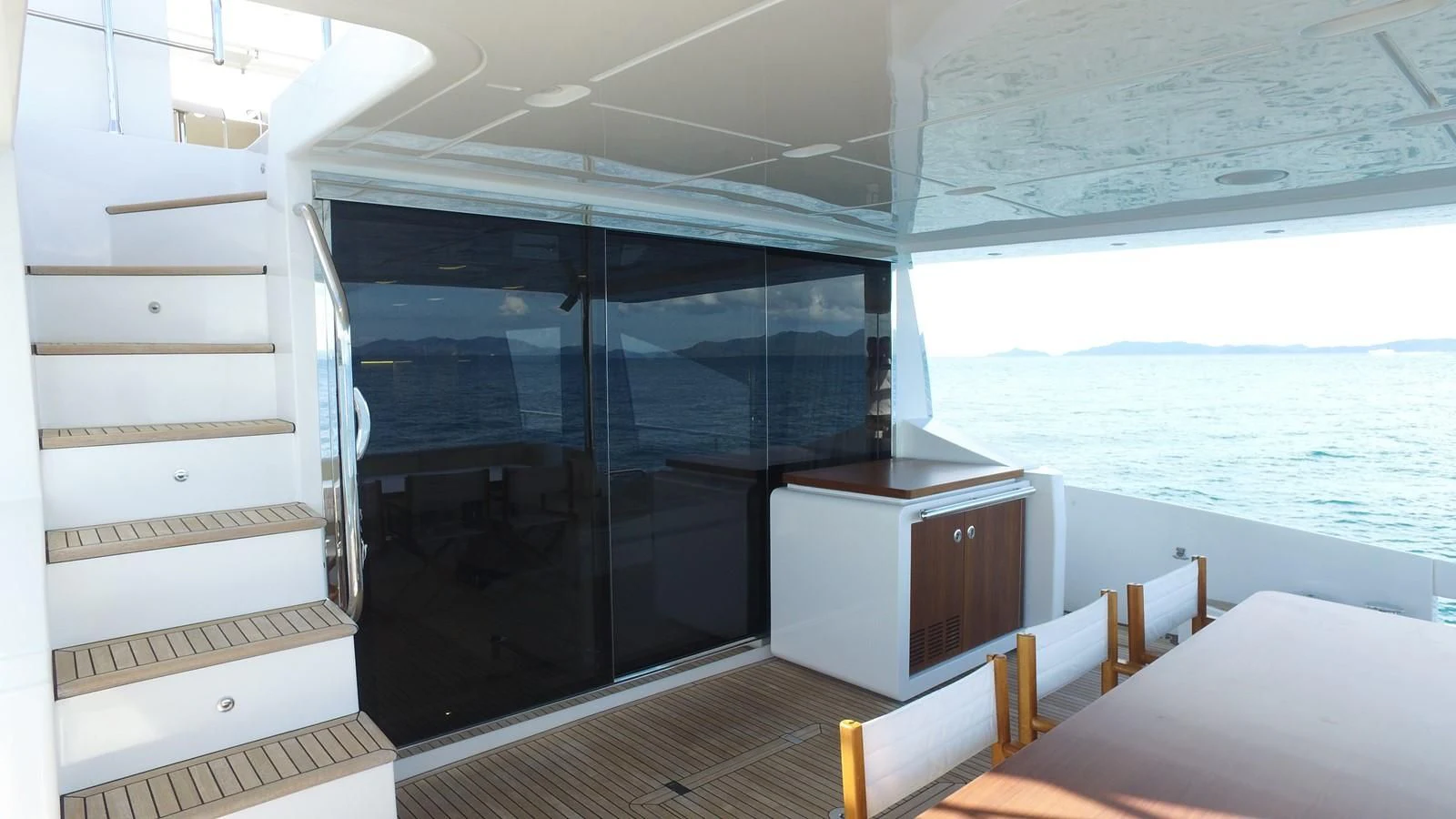 a room with a bed and a large window aboard SOLACE NT Yacht for Sale