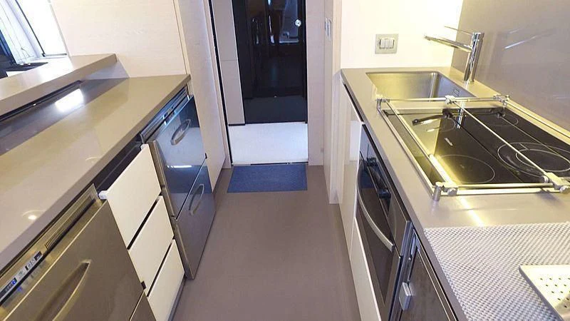 a kitchen with a sink and a stove aboard SOLACE NT Yacht for Sale
