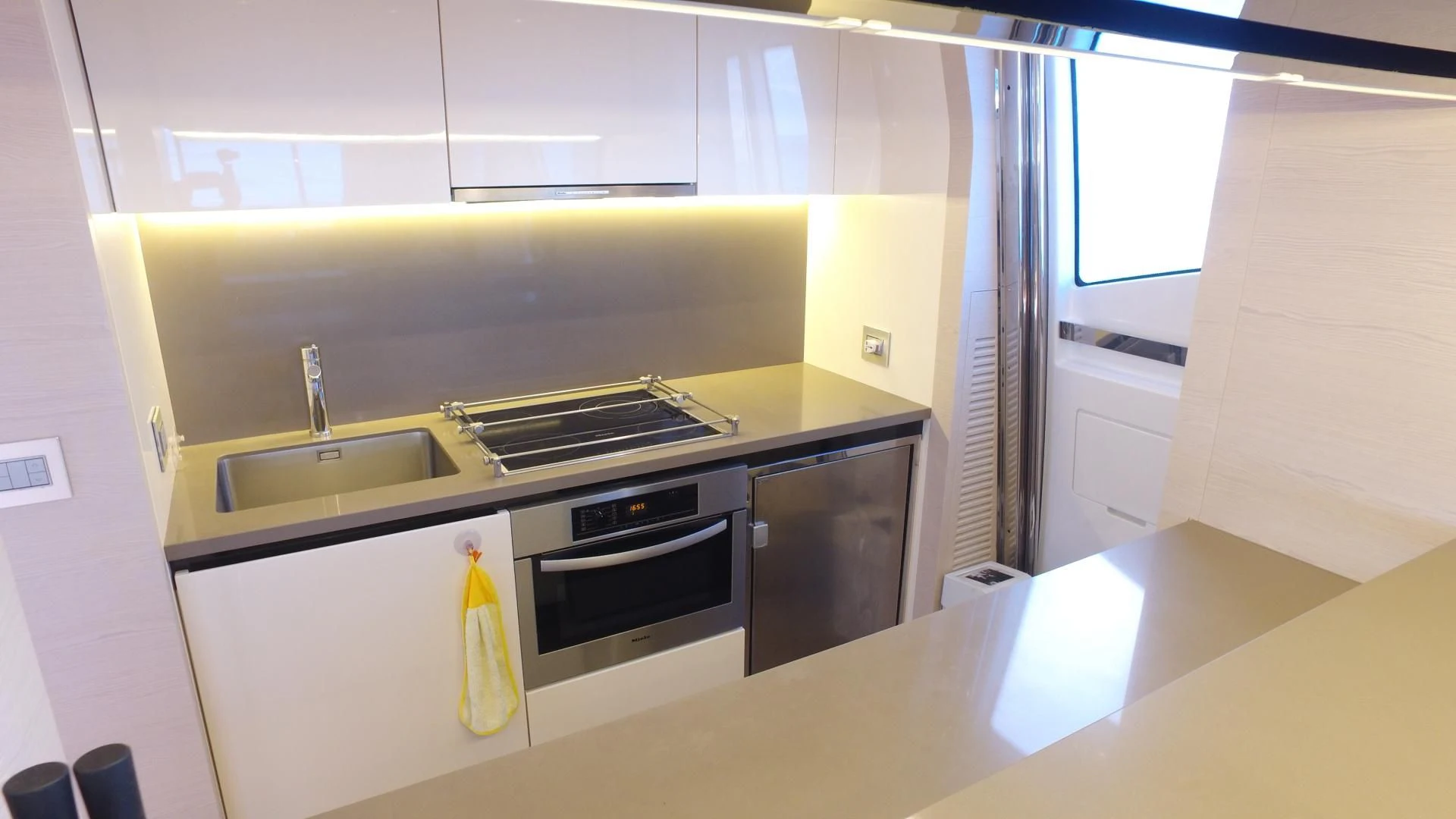 a kitchen with a stove and sink aboard SOLACE NT Yacht for Sale