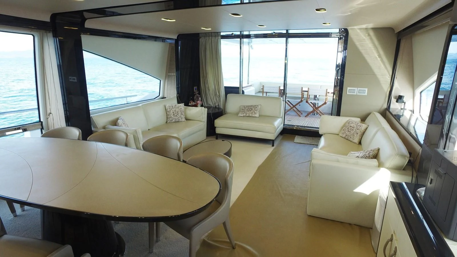 a living room with a large window aboard SOLACE NT Yacht for Sale