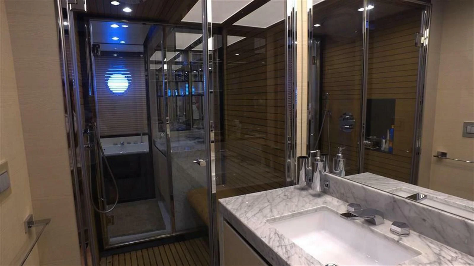 a bathroom with a large mirror aboard SOLACE NT Yacht for Sale