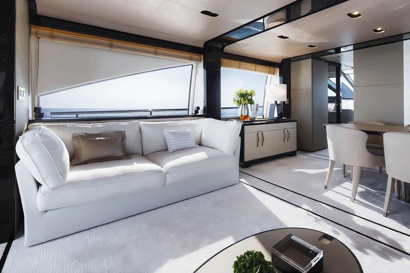 a living room with a couch and a table aboard SOLACE NT Yacht for Sale