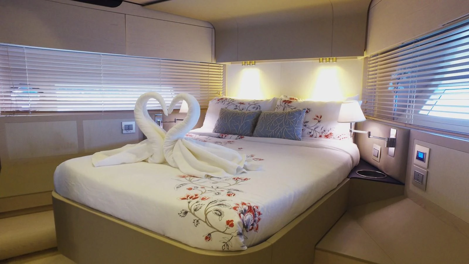 a bed with a white sheet and a pillow on it aboard SOLACE NT Yacht for Sale