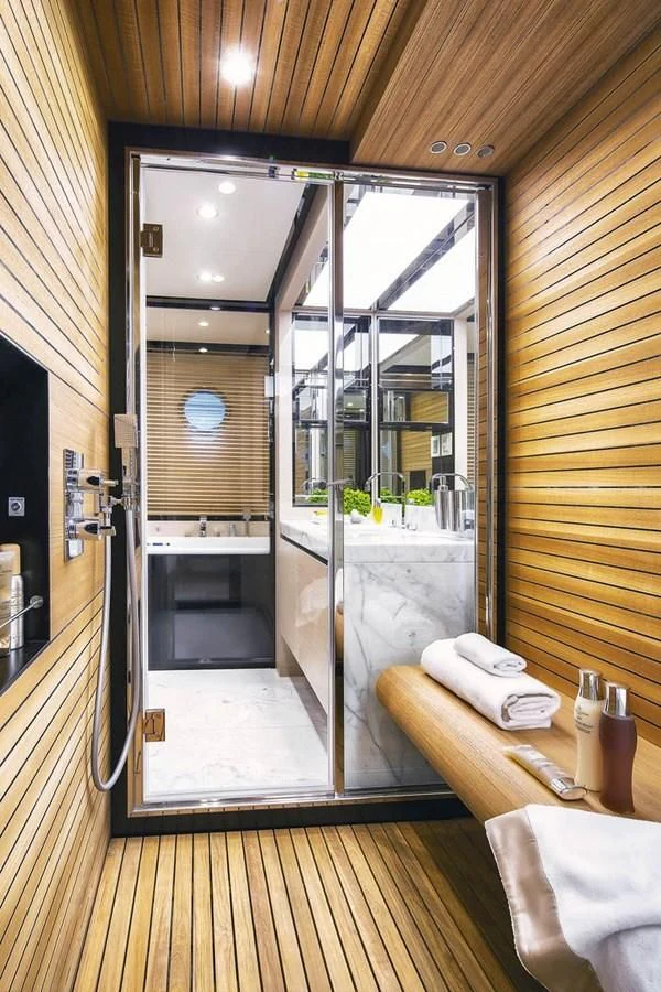 a bathroom with a large glass shower aboard SOLACE NT Yacht for Sale