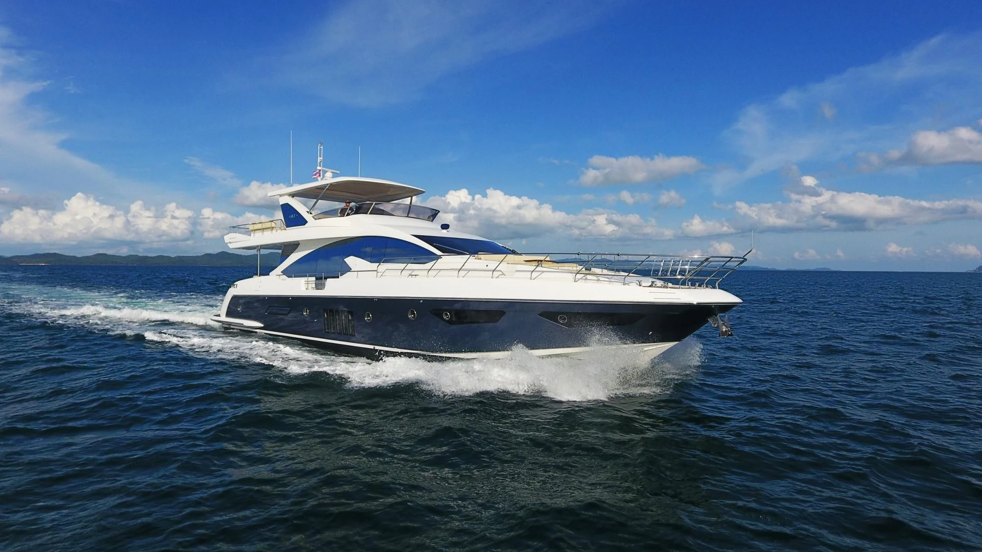 a white boat on the water aboard SOLACE NT Yacht for Sale