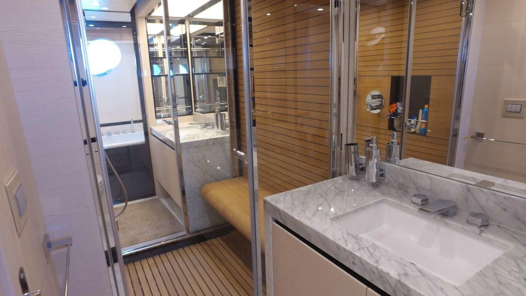 a bathroom with a sink and a shower aboard SOLACE NT Yacht for Sale