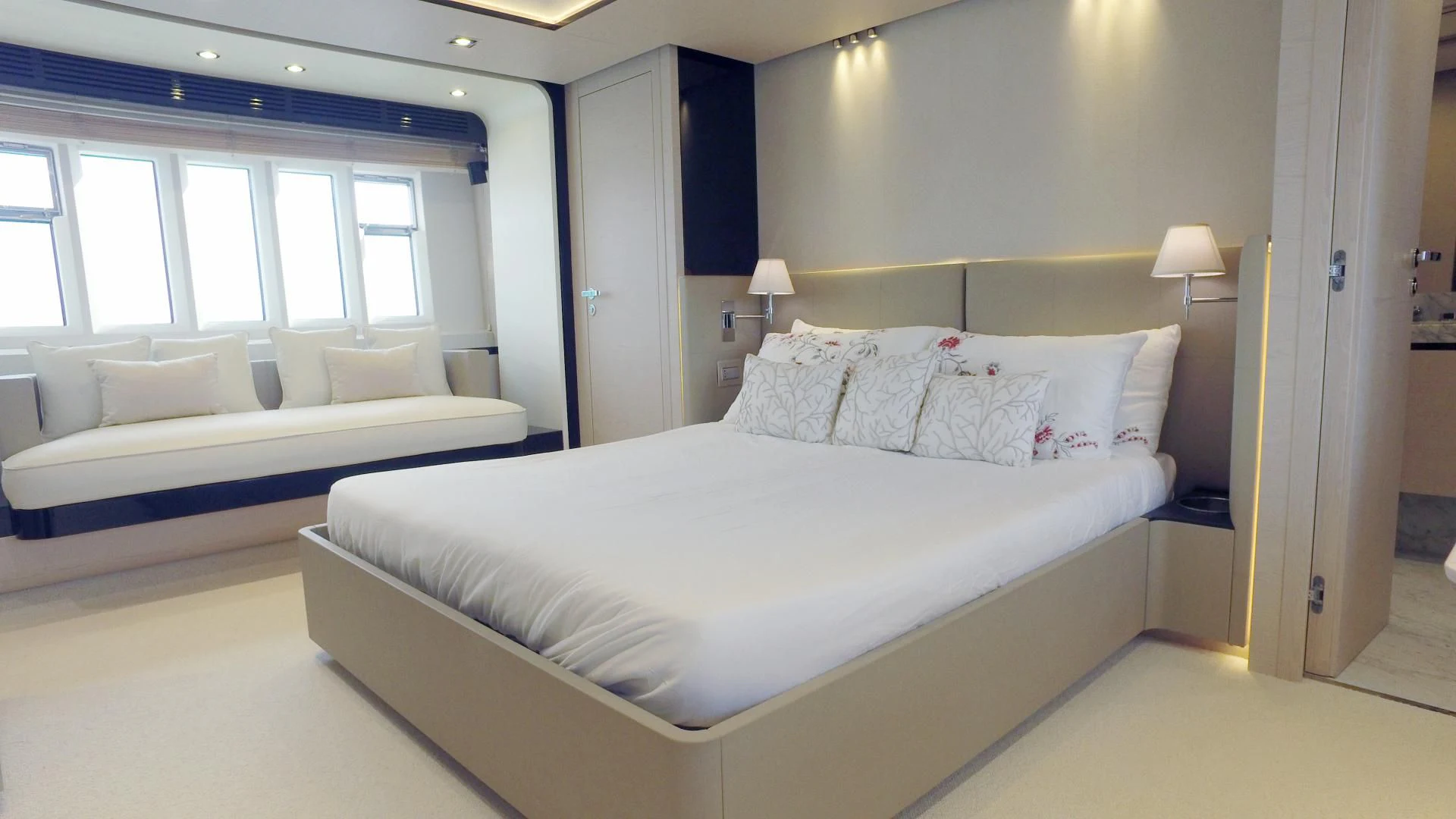 a room with a bed and a couch aboard SOLACE NT Yacht for Sale