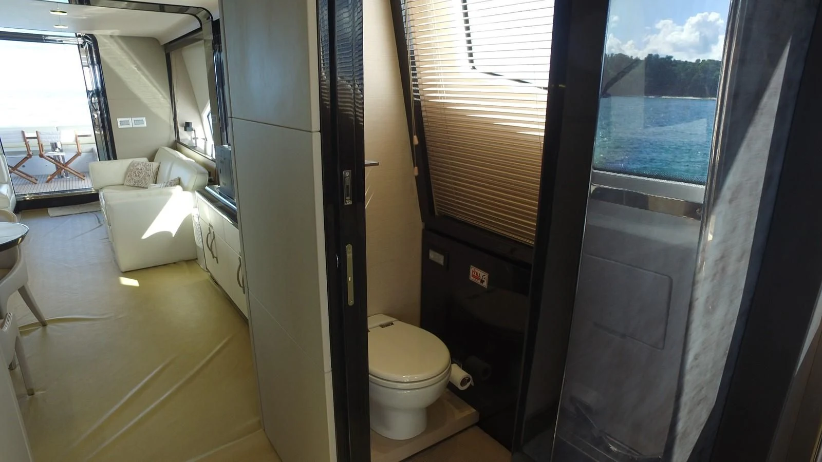 a room with a window and a toilet aboard SOLACE NT Yacht for Sale